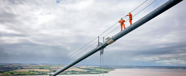 Bridge Workers Working on Cable of a Suspension Bridge